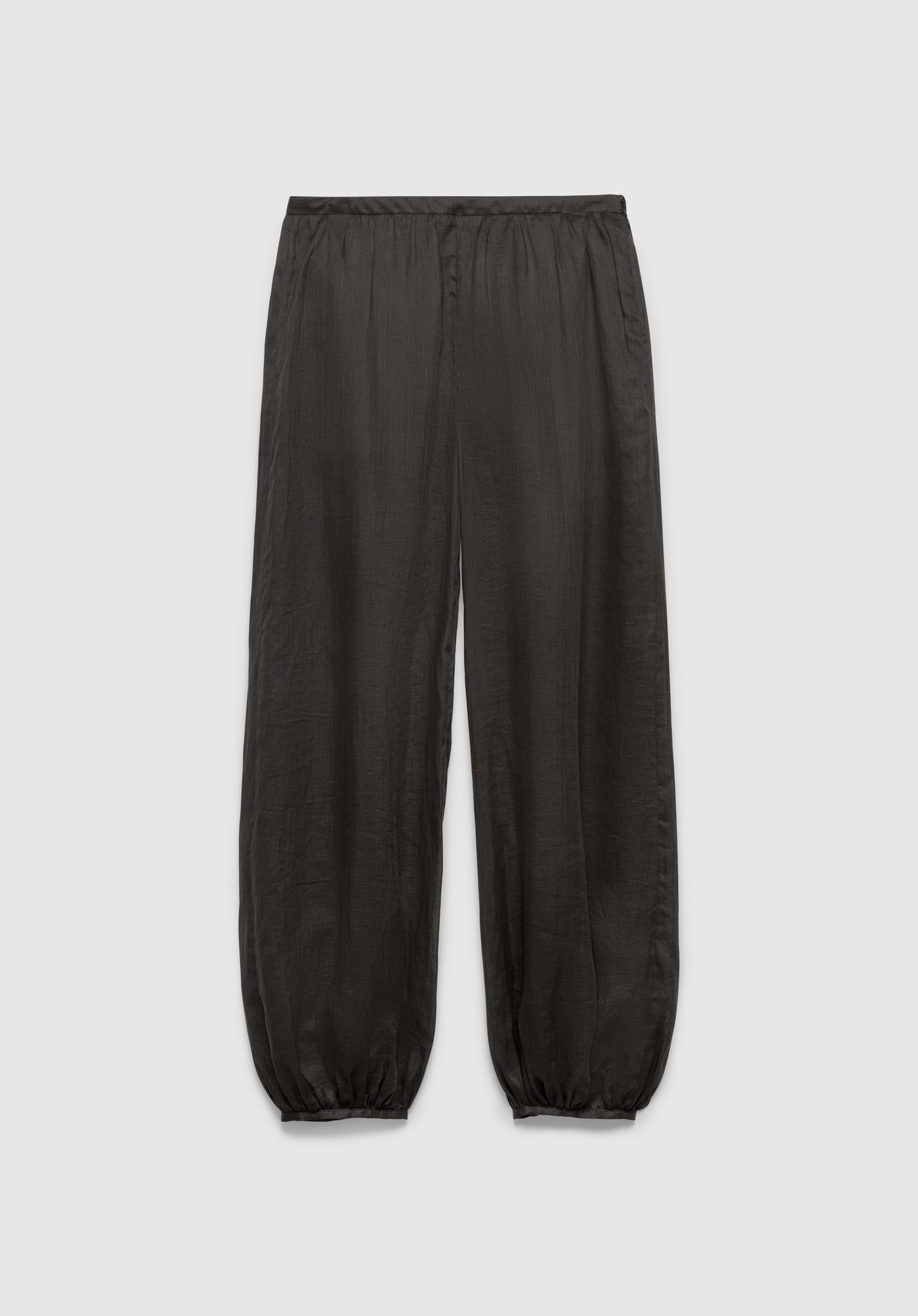 A pair of dark gray relaxed-fit pants with an elastic waistband and gathered cuffs at the ankles, featuring a lightweight, slightly textured fabric, displayed against a plain background.
