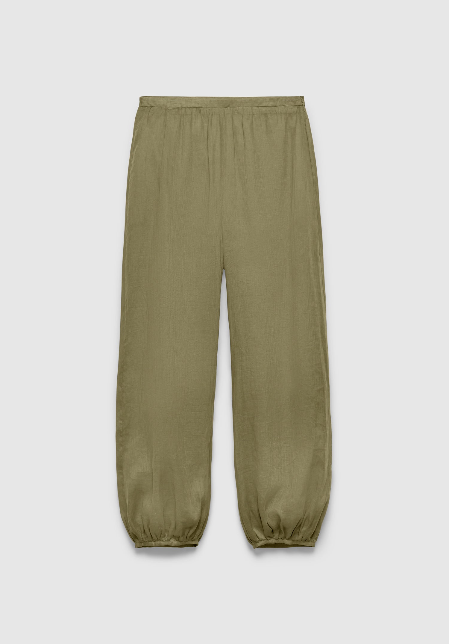 A pair of olive green relaxed-fit pants with an elastic waistband and gathered cuffs at the ankles, featuring a lightweight, slightly textured fabric, displayed against a plain background.

