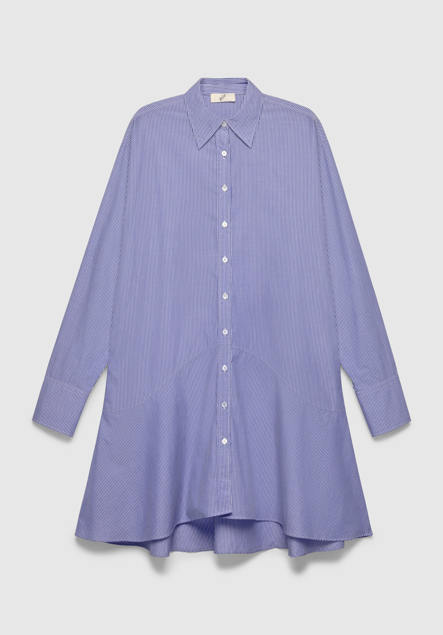 A blue and white vertically striped long-sleeve shirt dress with a pointed collar and front button closure, featuring a loose, flared silhouette, displayed against a plain background.
