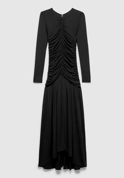 A black long-sleeve maxi dress with a fitted bodice, featuring ruched detailing down the front and a flowing, draped skirt, displayed against a plain background.
