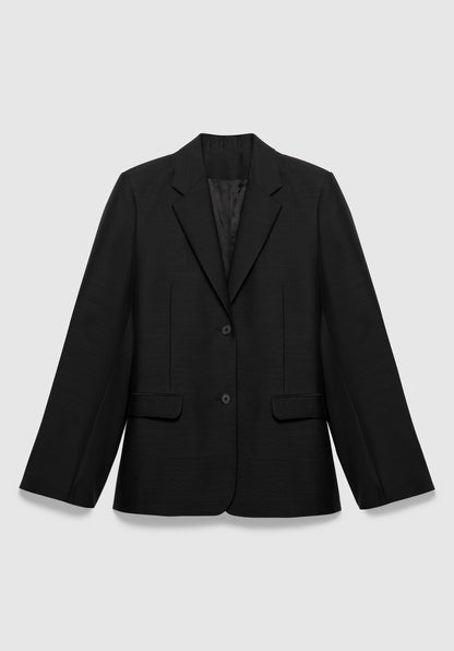 A black tailored blazer with a structured fit, featuring a notched lapel, two-button front closure, and flap pockets, displayed against a plain background.
