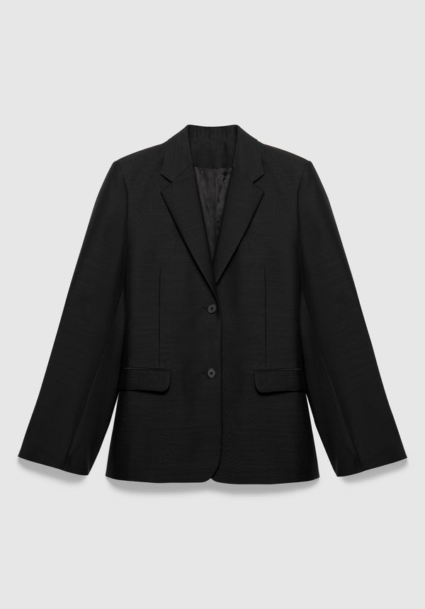 A black tailored blazer with a structured fit, featuring a notched lapel, two-button front closure, and flap pockets, displayed against a plain background.
