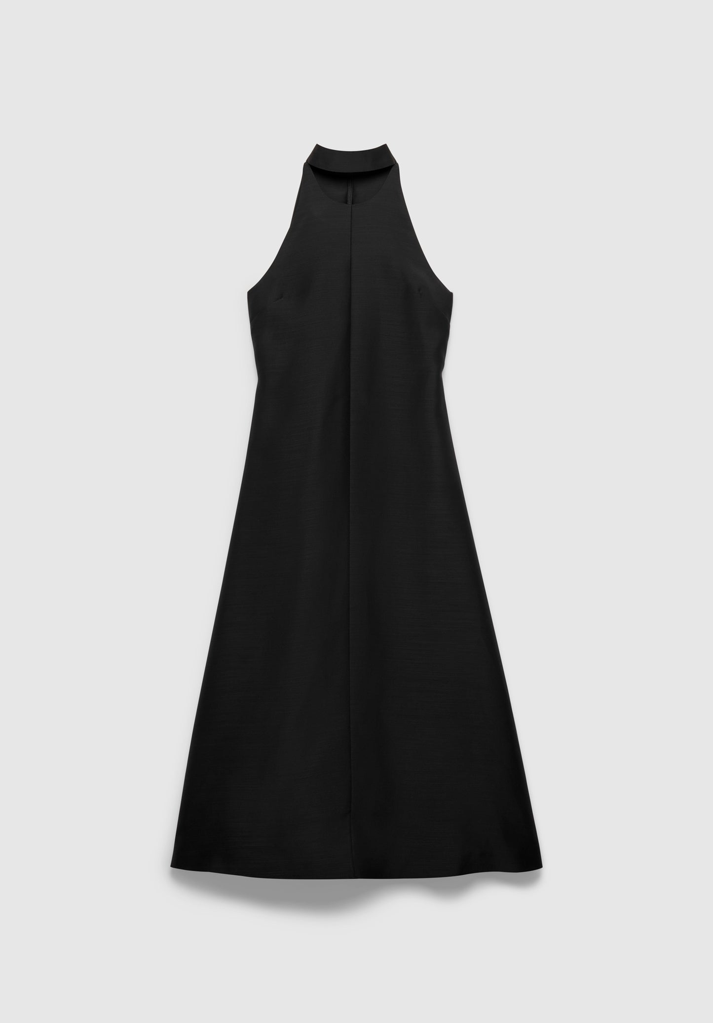 Black sleeveless A-line midi dress with a high halter neckline, minimalist design, and smooth, structured fabric, shown against a plain light background.
