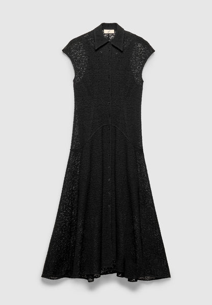 A black sleeveless midi dress with a pointed collar and front button closure, featuring a textured lace fabric and a softly flared skirt, displayed against a plain background.
