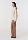 Asymmetric v-neck merino sweater off white